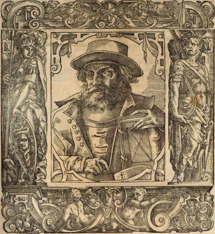 Bärtiger Mann frontal mit breitkrempigem Hut und Calotte sowie Buch in der linken Hand